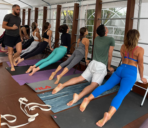 a man watching a yoga class