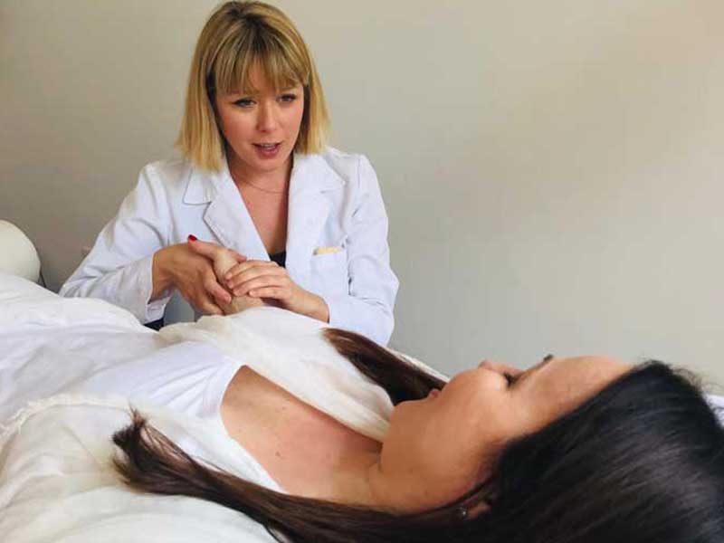 woman applying acupuncture 